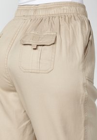 Koroshi LONG JOGGING  - Traperice suženog kroja - beige