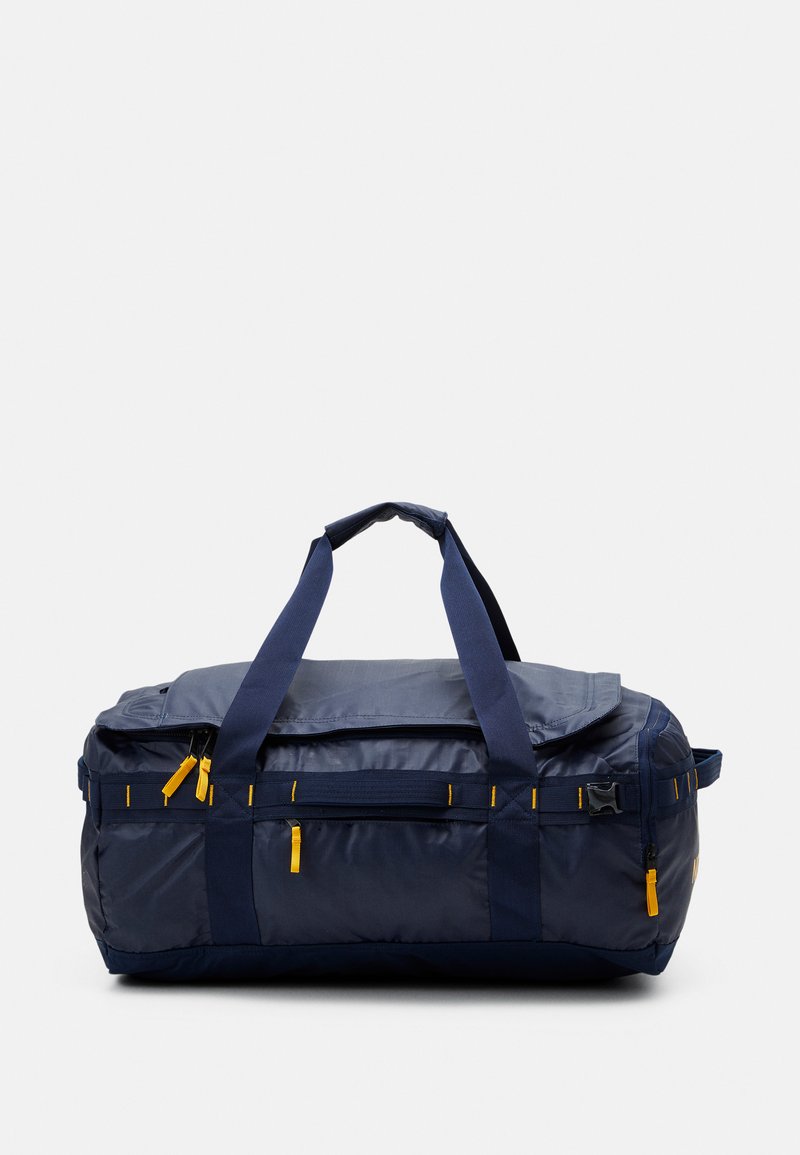 The North Face BASE CAMP VOYAGER DUFFEL UNISEX Valigia summit navy/summit gold/blu scuro The North Face BASE CAMP VOYAGER DUFFEL UNISEX Valigia summit navy/summit gold/blu scuro