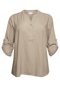 Beżowa lniana bluzka z kołnierzykiem mandaryńskim, półzaszewkiem na guziki i podwiniętymi rękawami. Miękka w dotyku i o luźnym kroju.