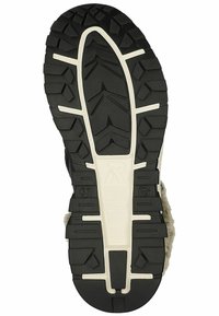 Suela de zapato de goma negra con un patrón de relieve profundo, detalles en blanco y superficie texturizada. Tamaño 37 marcado en el lateral. Diseñada para proporcionar agarre y durabilidad.