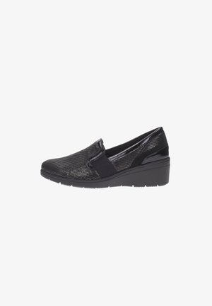 Scarpe slip-on nere in tessuto testurizzato, con tacco a zeppa basso e pannelli elastici laterali per facilitare l'indossamento. Fodera interna liscia.