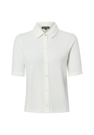 Chemise blanche à manches courtes avec col et boutons, en tissu tricoté doux, présentée sur un fond blanc uni.