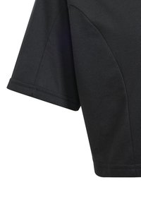 Black short-sleeve T-shirt made of soft cotton, featuring a crew neckline and curved hem, with subtle seam detailing on the sides.