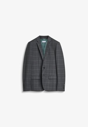 Blazer à carreaux gris avec un revers cranté, fermeture à un bouton et deux poches frontales. Doublé d'un intérieur vert et avec des boutons détaillés.