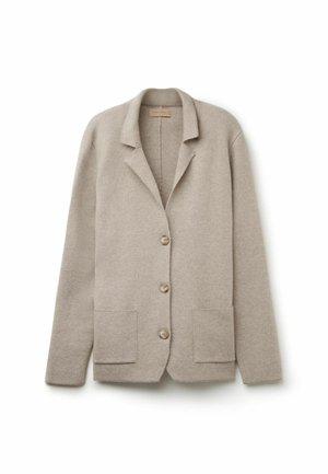 Beige ullblandad kavaj med slag, tre knappar och två framfickor. Tyget har en mjuk textur och ger en lätt värme.