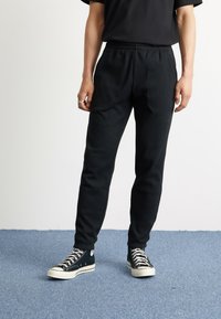 adidas Originals Träningsbyxor - black