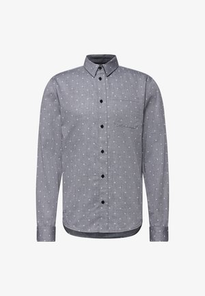 Chemise à manches longues à boutons grise avec des accents blancs à motifs. Dotée d'un col pointu, d'une poche poitrine unique et de boutons noirs.