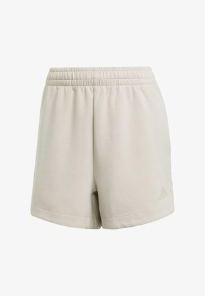 Light beige cotton shorts with an elastic waistband, side pockets, and a small tone-on-tone logo detail at the bottom hem.