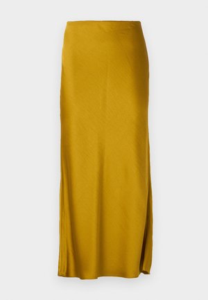 Saia maxi amarelo mostarda em tecido liso com silhueta reta. Apresenta uma fenda lateral e uma cintura elástica.