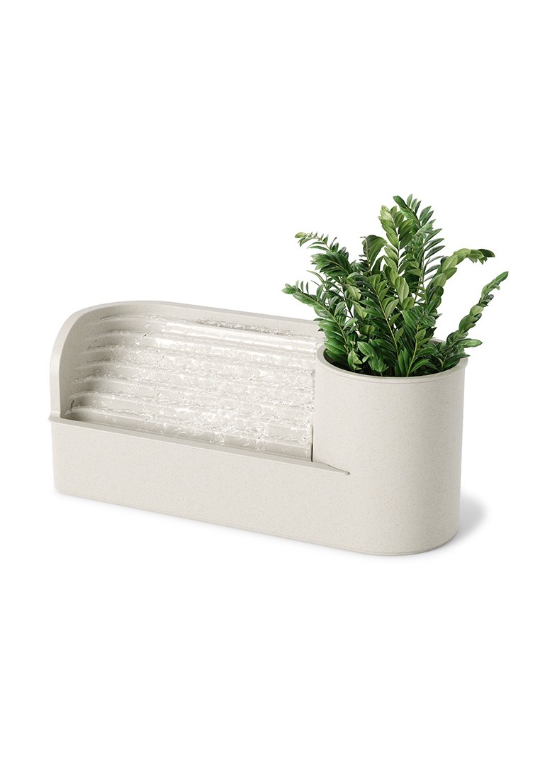 Blumentopf mit einer strukturierten, hellbeigen Basis und einem klaren, gerippten Abschnitt. Enthält eine grüne Pflanze mit schlanken Blättern, die ein modernes Design schafft.