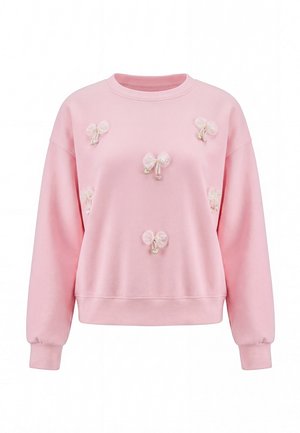 Lysrosa sweatshirt med lange ærmer, dekoreret med gennemsigtige stofsløjfer og små hjertevedhæng foran. Ingen synlig model eller baggrund.