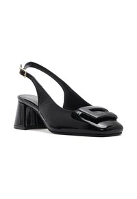 Black patent leather slingback shoe with a square buckle on the toe, low block heel, and a smooth finish. Adjustable ankle strap included.