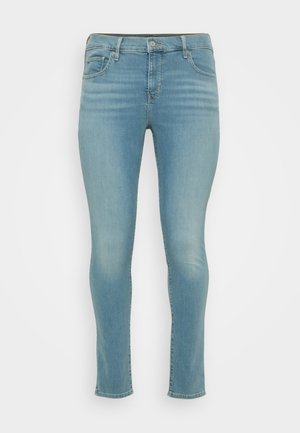 Gai zila džinsu auduma bikses ar šauru piegriezumu, vidēja augstuma jostasvietu, piecām kabatām un vieglu izbalējumu. Audumam ir gluda tekstūra.