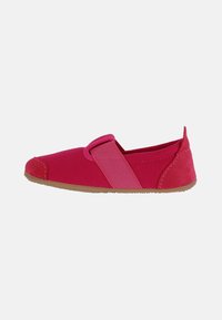 Pink slip-on shoe with a combination of textured fabric and suede, featuring a wide elastic strap across the top and a rubber sole.