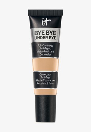 Tube de correcteur IT Bye Bye Under Eye à couvrance totale, anti-âge, résistant à l'eau, avec un capuchon noir et le produit beige visible à travers l'emballage.