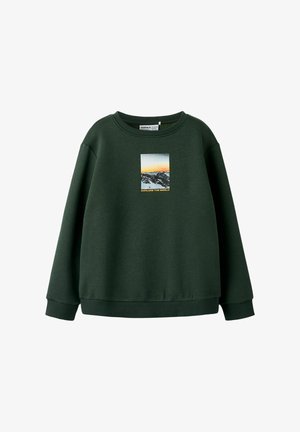 Olive green sweatshirt with a crew neck, featuring a rectangular graphic of mountains and the text "EXPLORE THE WORLD" in yellow.