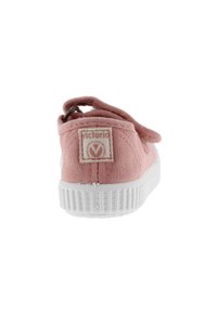 Scarpa slip-on in tela rosa con suola in gomma bianca, dotata di un'anello sul retro e di una patta con logo cucita sul tallone. Tessuto texturizzato.