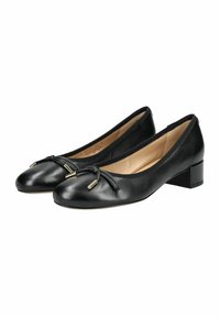 Ballerine in pelle nera con punta arrotondata, tacco basso e dettaglio a fiocco con accenti dorati sulla parte anteriore.