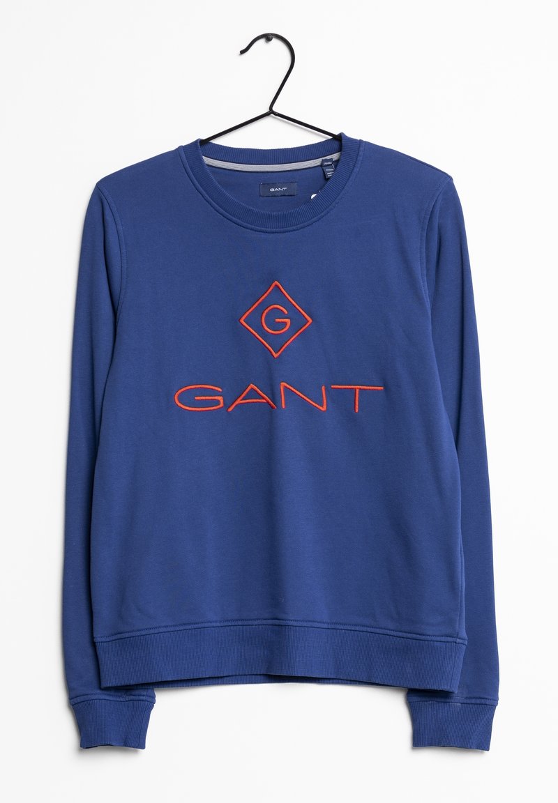 Sweat-shirt bleu avec poignets et ourlet côtelés, présentant un logo GANT orange brodé et une forme de losange sur le devant. Confectionné en tissu texturé.