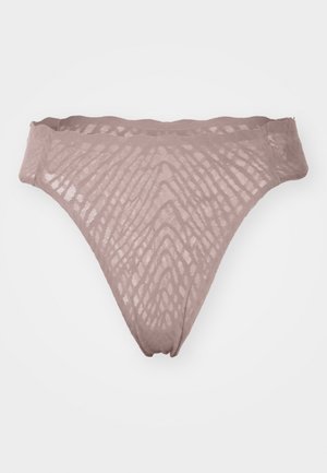 Spiss truse i lysebeige med et teksturert mønster. Har en glatt midjebånd og et fint, gjennomsiktig materiale. Lett og fleksibelt design.