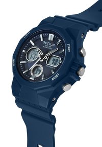 Orologio digitale blu navy con quadrante rotondo, cinturino in gomma, display dell'ora multiplo e pulsanti in acciaio inossidabile. Presenta una lunetta testurizzata.