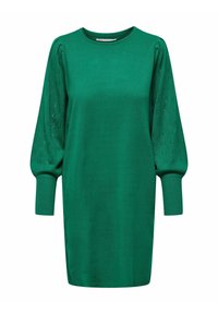 Grön klänning med rundad halsringning, långa puffärmar med hålmönster och en figursydd kropp som smalnar av vid fållen.