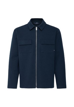 Veste bleu foncé avec fermeture éclair à l'avant, deux poches poitrine à rabat, manches longues et col classique, présentée sur un fond blanc.