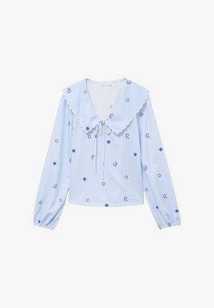 Blue and white striped long-sleeve blouse with a scalloped collar, tie detail, and scattered blue sun and star motifs.