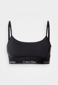 Zwarte sportbh met dunne bandjes en een gladde textuur. Beschikt over een logoband aan de onderkant met "Calvin Klein" in het wit. Klassiek minimalistisch design.