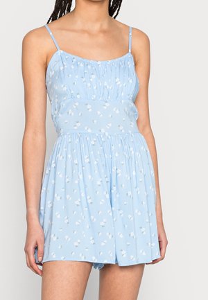 Hellblauer ärmelloser Jumpsuit mit einem plissierten Oberteil, floralem Muster und gerafftem Ausschnitt, der einen lockeren Sitz und weichen Stoff bietet.