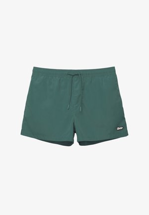 Zelené plavecké šortky vyrobené z ľahkého materiálu, s elastickým pásom na stiahnutie, bočnými vreckami a malou nášivkou loga.