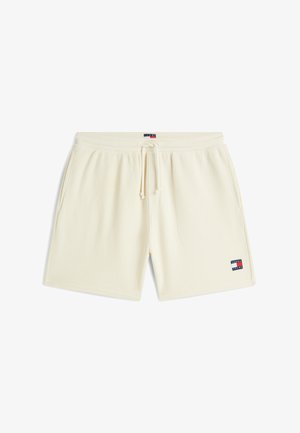 Cremefarbene, strukturierte Strickshorts mit elastischem Bund, Kordelzug, Seitentaschen und Tommy Jeans Logo-Patch am linken Bein und in der Mitte des Bundes.