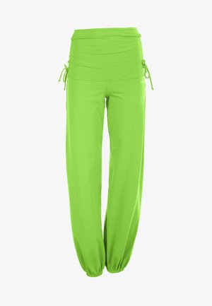 Lime zöld, bő szárú nadrág puha anyagból. Magas derékkal rendelkezik, amely állítható megkötőkkel és rugalmas mandzsettákkal a szegélyen.