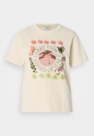 Cream-colored cotton t-shirt featuring vibrant embroidered graphics including text and tropical motifs in shades of green, pink, and orange.