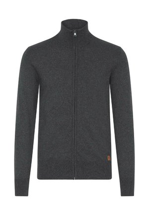 Sweat à zip gris foncé avec un col montant, fabriqué en tricot doux. Dispose de longues manches et d'une petite étiquette logo beige sur le côté inférieur.