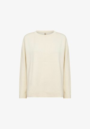 Világos bézs színű, hosszú ujjú felső, kerek nyakkivágással, egyszerű dizájnnal és puha textúrával, középen varrási részletekkel kiemelve.