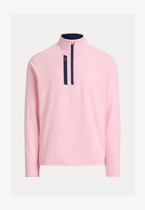 Hele roosa pika varrukaga pullover tumesinise luku detailiga kõrgel krael ja lisaks vertikaalne lukuga rinnatasku.