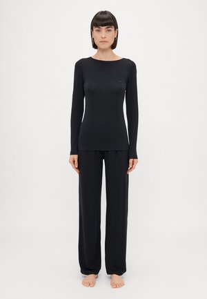 Black long-sleeve top and wide-leg pants made of soft fabric, featuring a simple round neckline and minimalistic design.