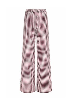 Pantalon à jambes larges avec taille élastique, présentant un motif à carreaux rouges et blancs sur le tissu.