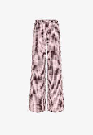 Pantalon à jambes larges avec taille élastique, présentant un motif à carreaux rouges et blancs sur le tissu.
