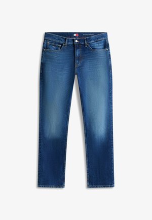 Sinised kitsad sirged teksapüksid viie taskuga, nööbi ja tõmblukuga ning õrnade pleekimistega reitel ja põlvedel.