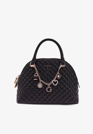 Sac à main noir matelassé avec poignées supérieures, quincaillerie dorée et ornements décoratifs comprenant un cadenas, un cœur et une fleur. Présente un emblème de logo.