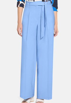 - Spodnie materiałowe