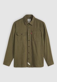 Olive green button-up shirt made of textured material, featuring long sleeves, two chest pockets, and a brand logo tag at the hem.