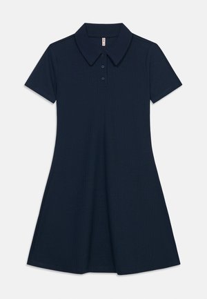 Laivastonsininen lyhythihainen poolomekko, jossa on kaulus ja kolmen napin lista, vartalonmyötäinen yläosa ja levenevä hame.