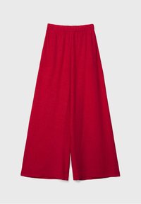Rote weit geschnittene Hosen aus leichtem Stoff mit elastischem Bund, die eine lockere Silhouette und eine glatte Oberfläche aufweisen.
