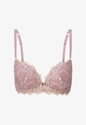 Krajková podprsenka v barvě šeříku s propracovanými béžovými květinovými vzory, krémovým krajkovým lemem, měkkým polstrováním a jemnou mašlí uprostřed.