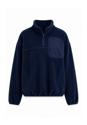 Pull polaire bleu marine avec fermeture éclair sur un quart, manches longues, taille et poignets élastiques, et une poche poitrine zippée sur le côté gauche.
