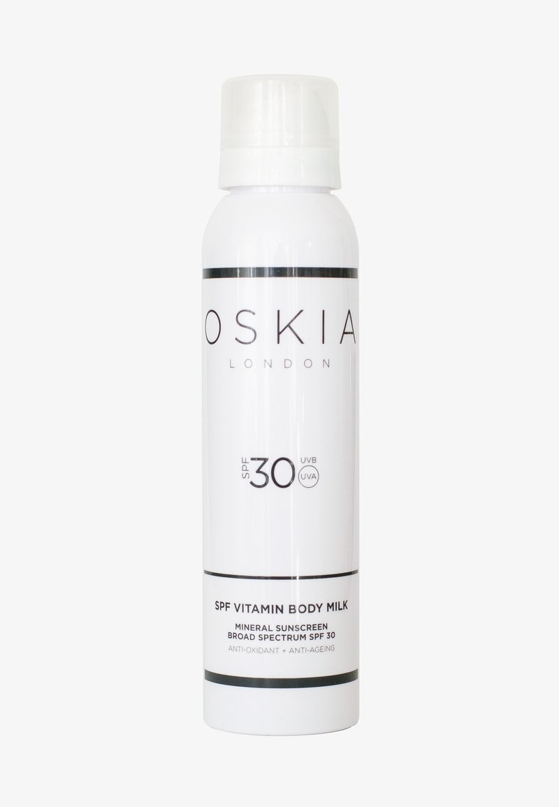 Flacon cylindrique blanc de lait corporel minéral OSKIA London SPF 30 avec protection à large spectre, antioxydant et propriétés anti-âge.