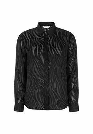 Juodas ilgomis rankovėmis marškinis su subtiliu zebra raštu, pagamintas iš lygaus audinio. Turi apykaklę ir mygtukų užsegimą priekyje.